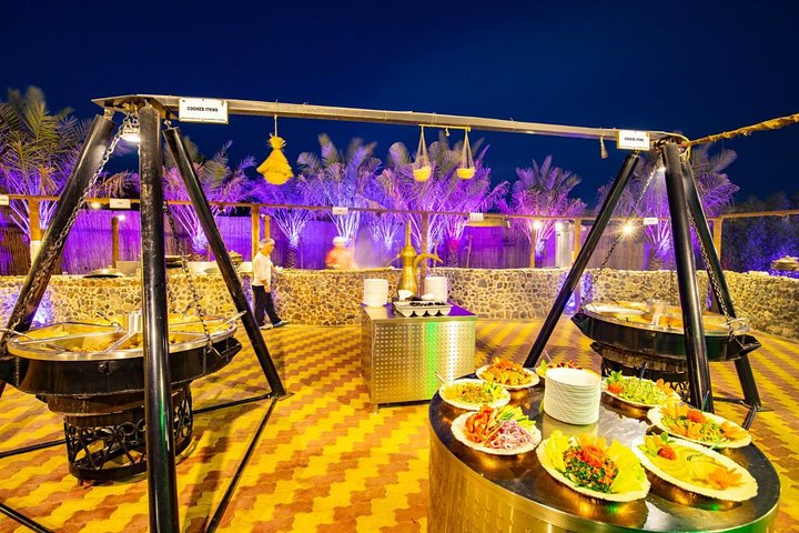 Experience a lavish BBQ dinner in the heart of the desert surrounded by stunning scenery delectable dishes and traditional entertainment under a starlit sky. Pure indulgence awaits.